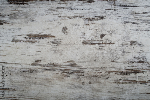 Woden surface with scratches, markings, lines, blazes, staines and cracks
