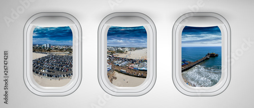 Santa Monica as seen through three aircraft windows. Holiday and travel concept