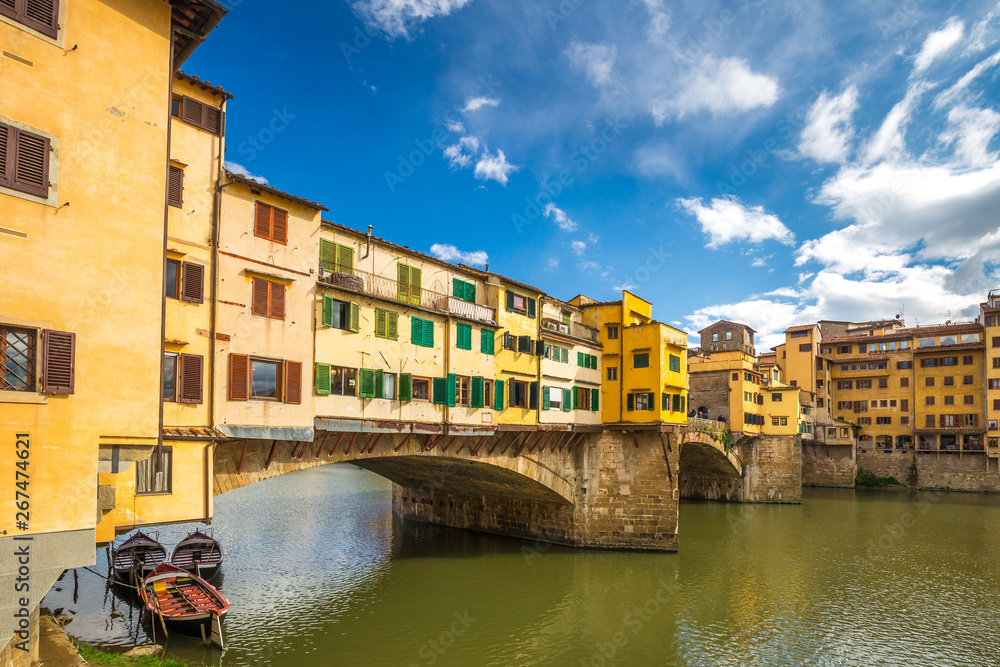 The Ponte Vecchio, medieval stone old bridge over the Arno River in Florence, Italy.