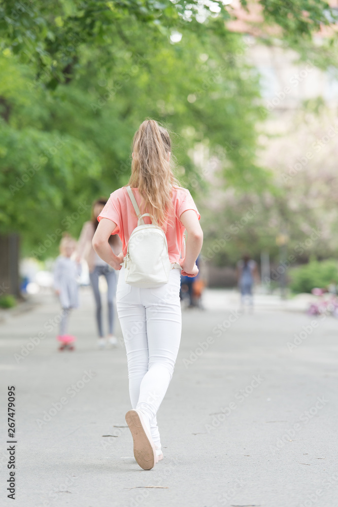 Girl carefree child. Kid long hair enjoy walking. Summer holidays. Little child enjoy walk. Health, good mood and positive energy. Energetic child. Save energy for long walk. Full of energy Girl carefree child. Kid long hair enjoy walking. Summer holidays. Little child enjoy walk. Health, good mood and positive energy. Energetic child. Save energy for long walk. Full of energy