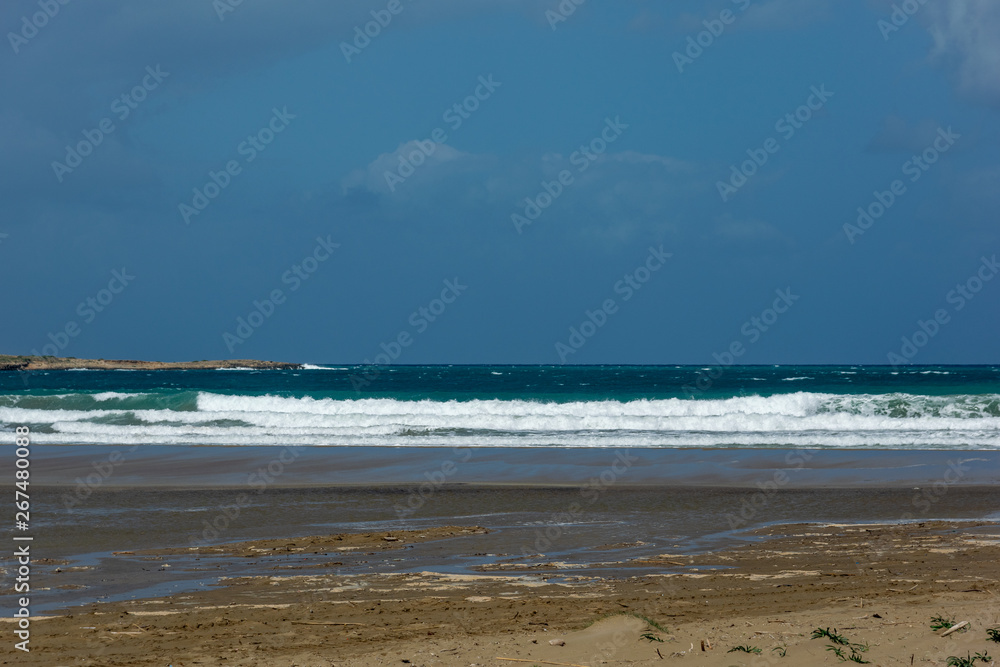 Waves On sand beach of the Aegean Sea in Rhodes.