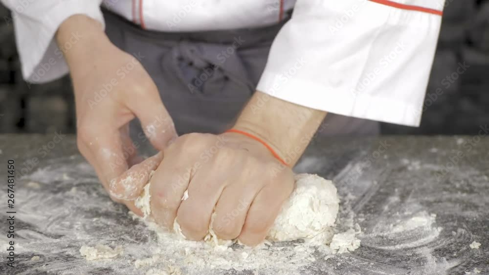 Male hands making dough for pizza Male hands making dough for pizza