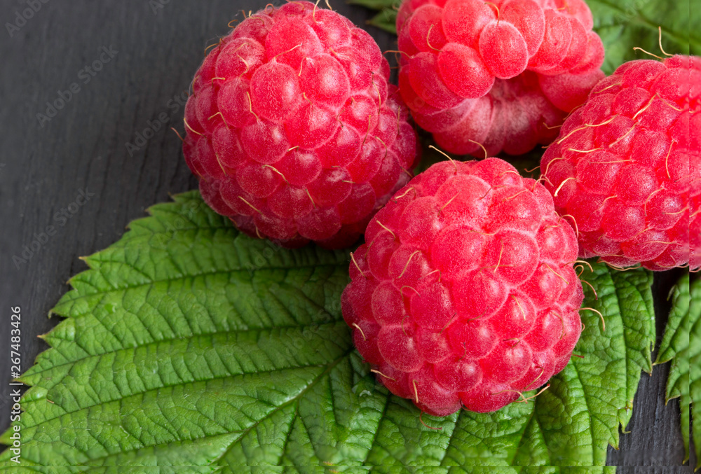Ripe raspberries on a wooden background. Ripe raspberries on a wooden background.