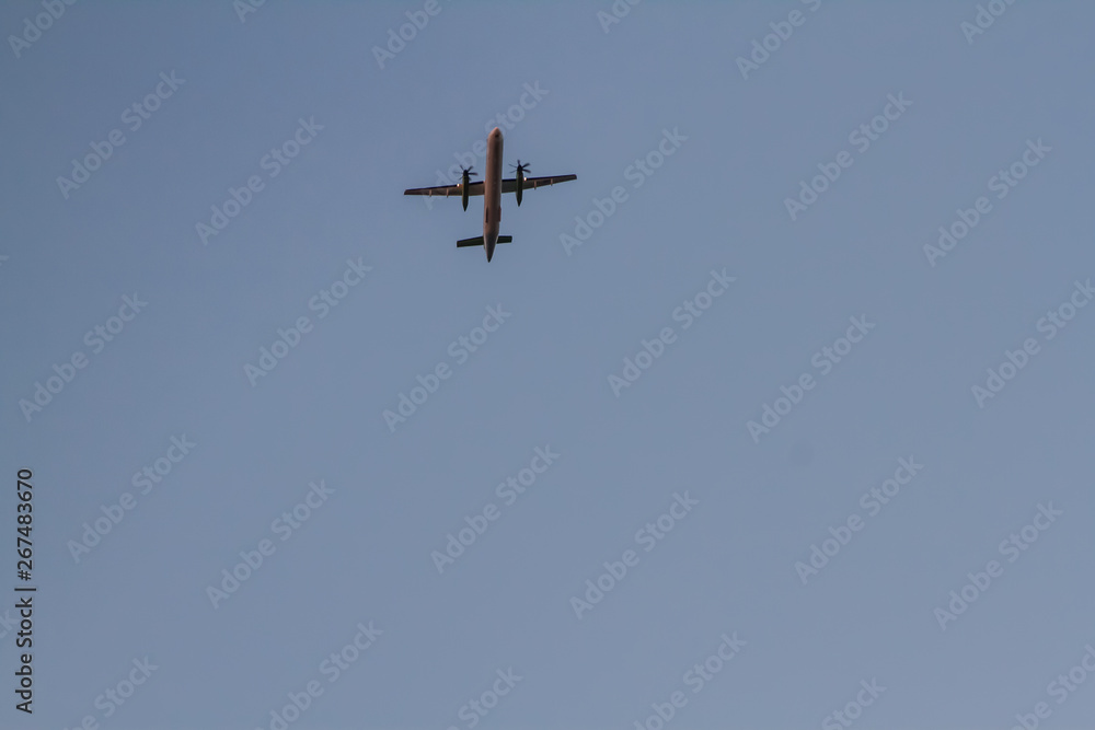 Aircraft on a background of cloudy sky. Landing a liner close-up. Spring. Day.