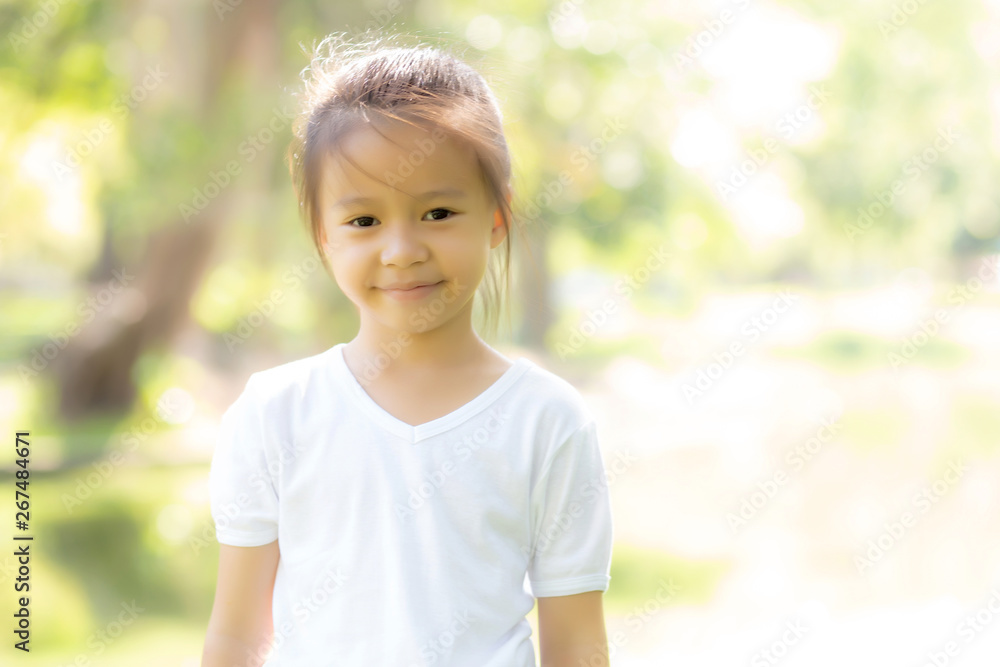 Portrait face of cute asian little girl and child happiness and fun in the park in the summer, smile and happy from asia kid and relax in the garden, lifestyle childhood concept. Portrait face of cute asian little girl and child happiness and fun in the park in the summer, smile and happy from asia kid and relax in the garden, lifestyle childhood concept.