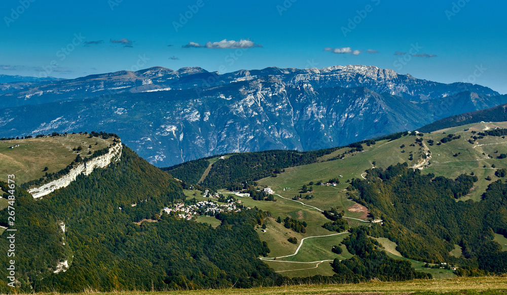 View of the Lake Garda from Monte Baldo, Italy.Panorama of the gorgeous Garda lake surrounded by mountains in the autumn View of the Lake Garda from Monte Baldo, Italy.Panorama of the gorgeous Garda lake surrounded by mountains in the autumn