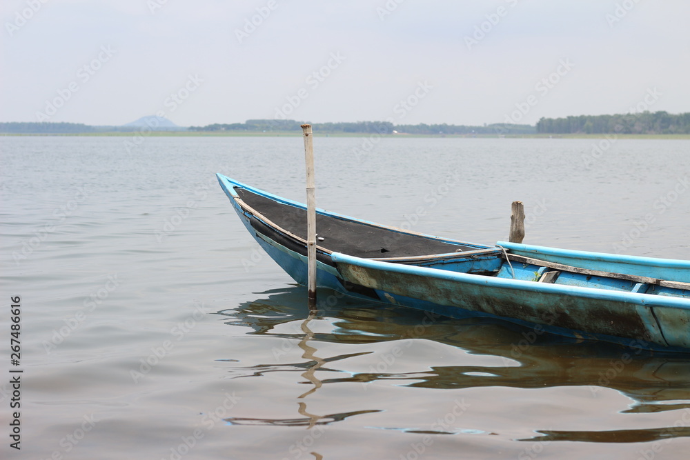 Old wooden fishing boats floating on the river