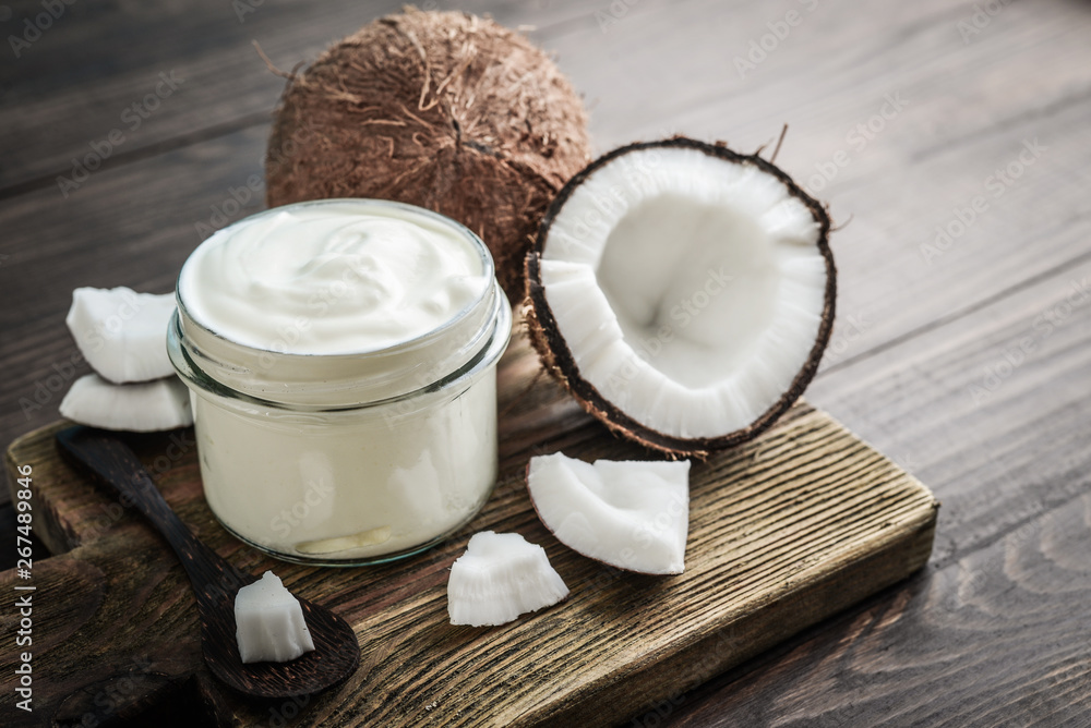 Coconut cream in a glass jar with fresh coconut Coconut cream in a glass jar with fresh coconut