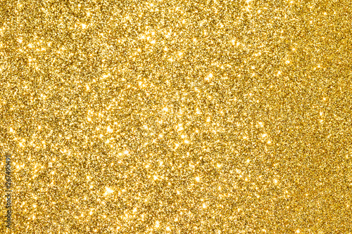 sparkles of golden glitter abstract background	 photo
