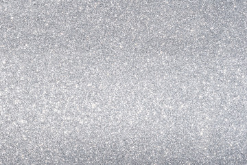 sparkles of silver glitter abstract background