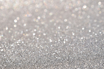 sparkles of silver glitter abstract background