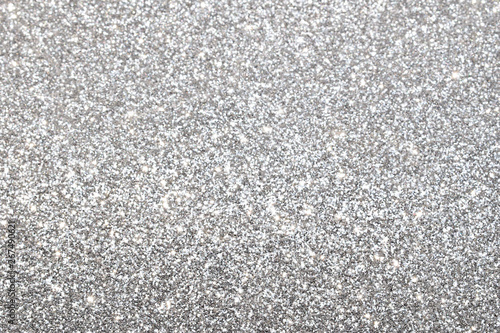 sparkles of silver glitter abstract background