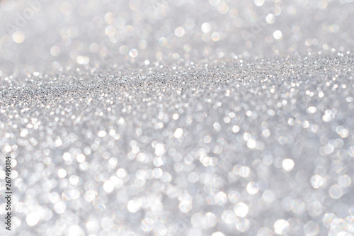 sparkles of silver glitter abstract background