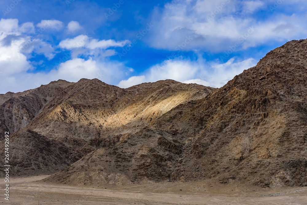 Panorama of the beautiful mountains that surround Leh at sunlight - Ladakh, Jammu and Kashmir, India. Panorama of the beautiful mountains that surround Leh at sunlight - Ladakh, Jammu and Kashmir, India.