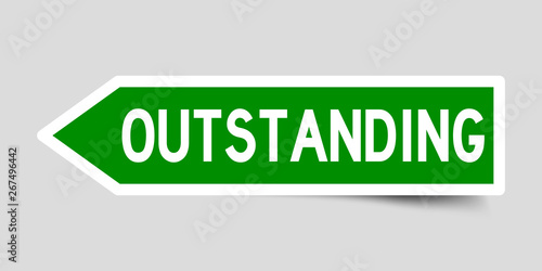 Arrow shape green color sticker in word outstanding on gray background