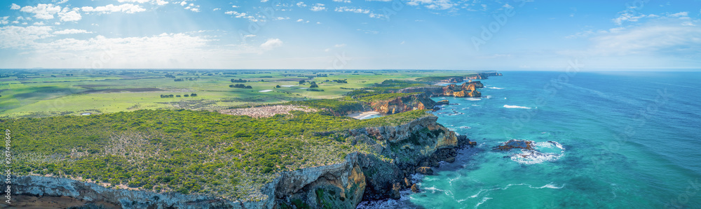 Wide aerial panorama of ocean coastline and countryside near Great Ocean Road, Victoria, Australia