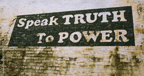 Painted sign on wall in Culpeper Virginia "Speak Truth to Power"