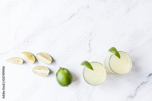 Health care, fitness, healthy nutrition diet concept. Fresh lime cocktail, detox drink, lemonade in a glass jar. copy space top view flat lay