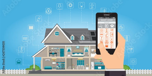 Smart home with hand holding smartphone.
