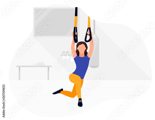 Fit woman working out on trx doing bodyweight exercises. Fitness strength training workout.