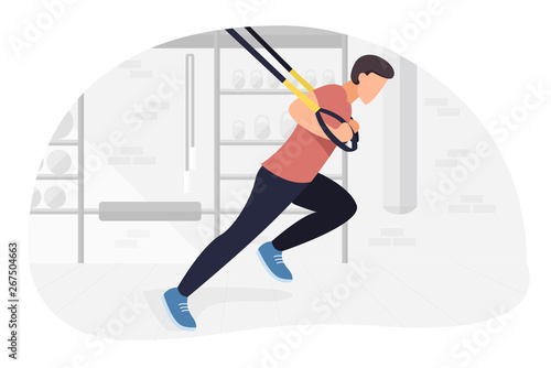 Fit man working out on trx doing bodyweight exercises. Fitness strength training workout.