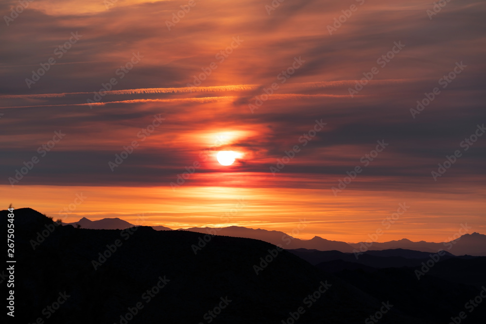 Dante's Fiery Dawn - sunrise with the orange blaze of an awakening sun