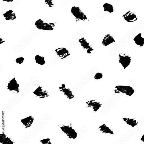 Seamless pattern with hand drawn black dots on white background. Polka texture. Vector illustration.