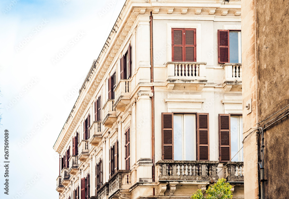 Sicily, beautiful cityscape of Italy, historical street of Catania, facade of old buildings .