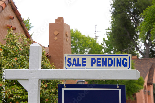 close up on Sale pending sign for home. First-time home buyers in California have a more difficult time affording property than do first-time buyers in other states.