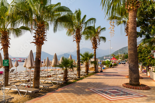 Fototapeta Naklejka Na Ścianę i Meble -  Beautiful promenade with palm trees in Marmaris. Turkey.