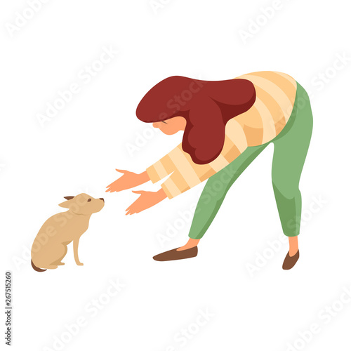 the girl reaches out to the little puppy. scared puppy. taming a pet