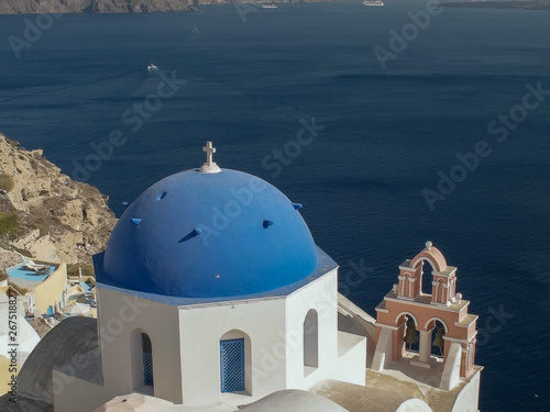 view of a blue church dome at oia on the island of santorini