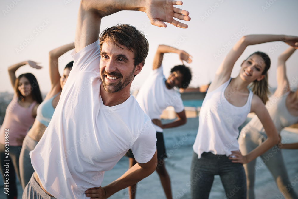 Fototapeta Fitness, sport, friendship and healthy lifestyle concept . Group of happy people exercising