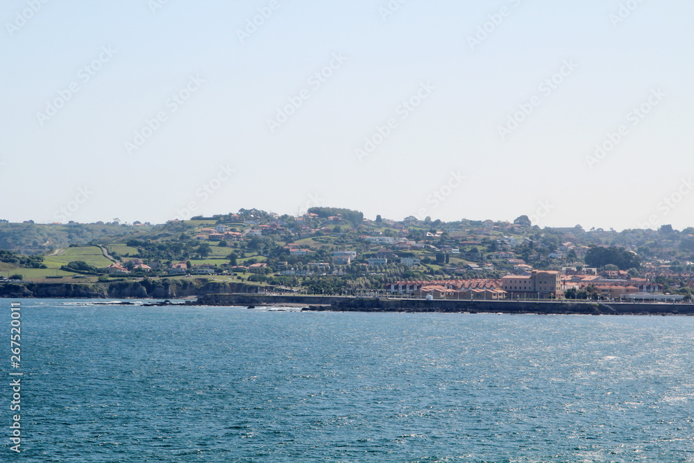 Coastline in Gijon, view to cliffs and ocean Coastline in Gijon, view to cliffs and ocean