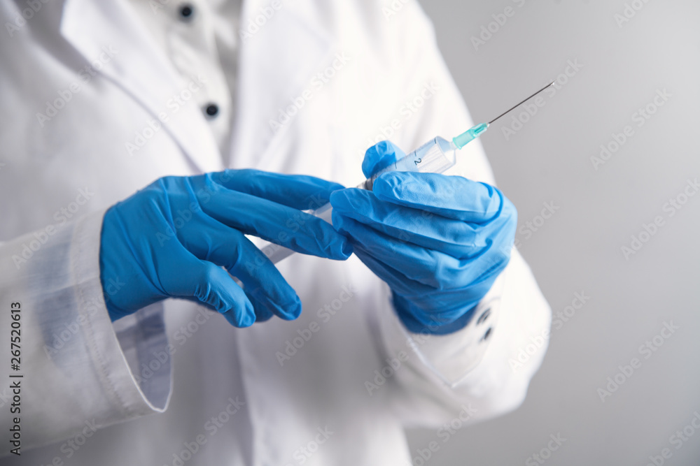 Doctor holding syringe. Healthcare and medical Doctor holding syringe. Healthcare and medical