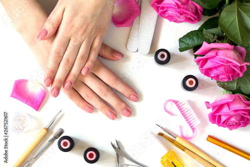 Concept Nails care background. Beautiful manicured woman s nails with pink polish  beauty salon.