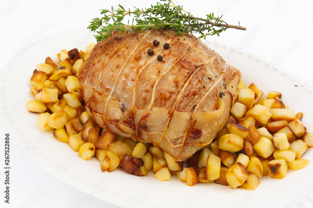 rôti de veau et pommes de terre rissolées Stock Photo | Adobe Stock