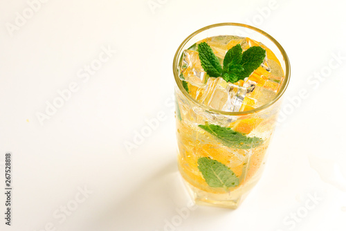 Cocktail with lemon and mint on a white background. Copy space.
