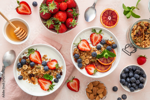 Healthy breakfast . Homemade granola with yogurt and fresh berries.