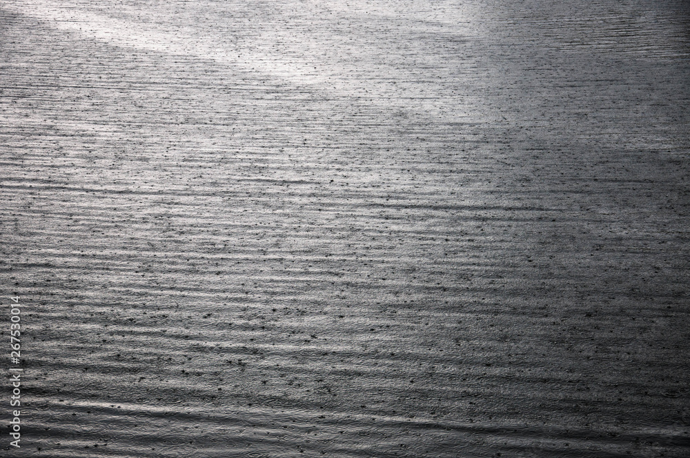 River surface with rain drops on it River surface with rain drops on it