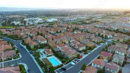 Drone/Aerial footage of suburbs and homes in Yorba Linda California. Suburban neighborhoods in the evening/sunsetting.