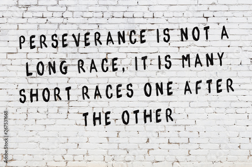 Принти на полотні White brick wall with painted black motivational quote inscription