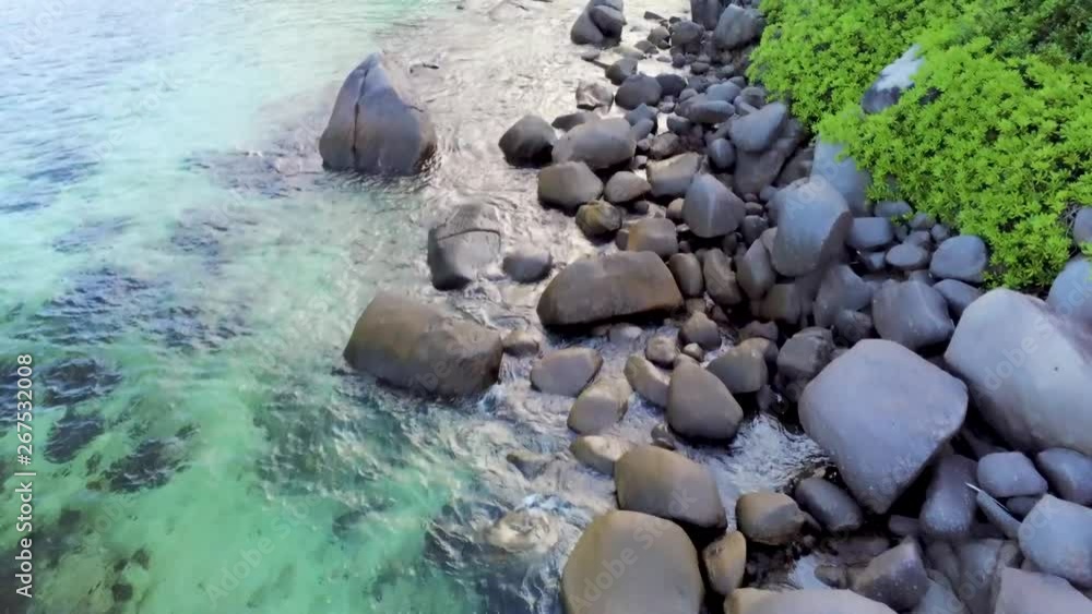 Gliding over the rocky shoreline to the beach. Segment 1 of 2 in Slow Motion Gliding over the rocky shoreline to the beach. Segment 1 of 2 in Slow Motion