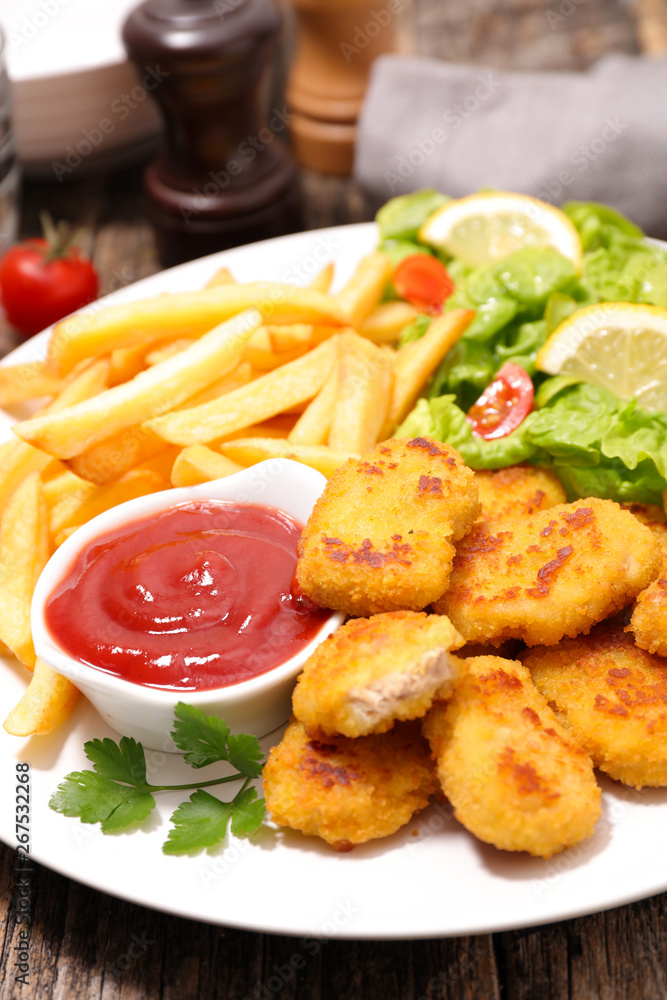 fried nugget with french fries and ketchup fried nugget with french fries and ketchup