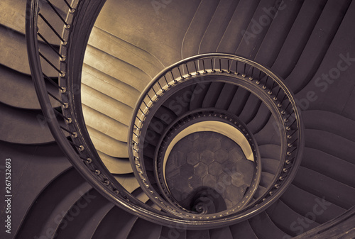 Antique spiral staircase in black and white.