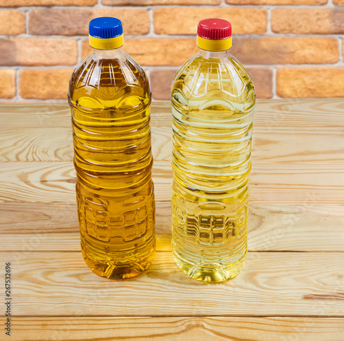 Fotografie Unrefined cold-pressed and refined sunflower oil in two bottles