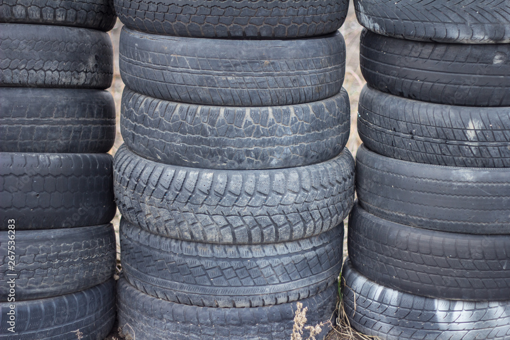 Old, worn car tires Old, worn car tires
