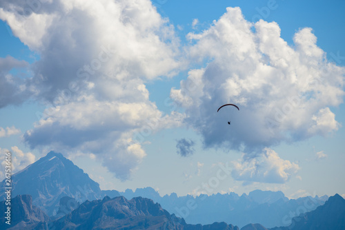parachute action activity ,cloud blue sky at Dolomite Alps, Italy