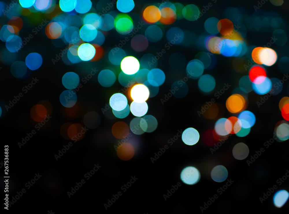 Colorful bokeh night light blur on black background with Christmas background  - obrazy, fototapety, plakaty 