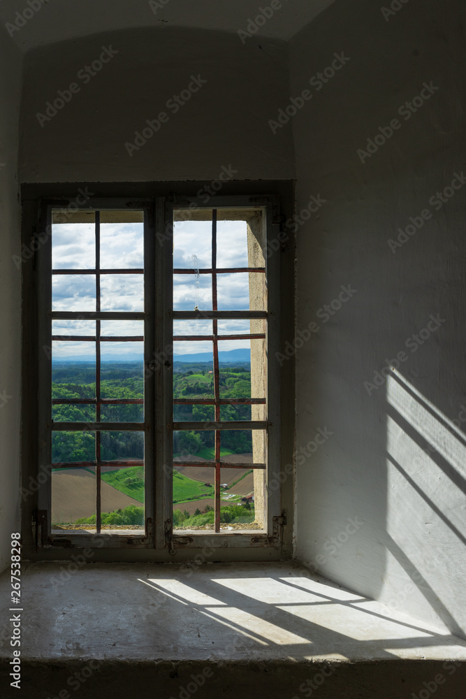 The landscape shines through the old castle's windows The landscape shines through the old castle's windows